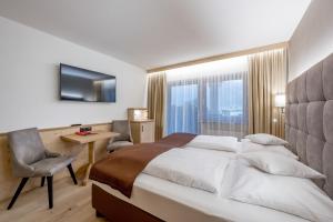 DER GREIL - Wein & Gourmethotel客房内的一张或多张床位