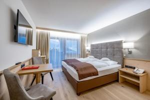 DER GREIL - Wein & Gourmethotel客房内的一张或多张床位