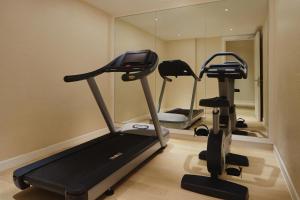 a gym with a treadmill and a mirror at The Westin Desaru Coast Resort in Desaru