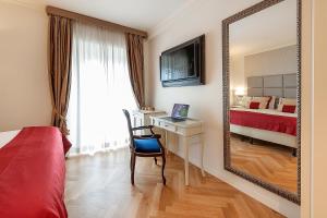 Televízia a/alebo spoločenská miestnosť v ubytovaní Dei Priori Boutique Hotel