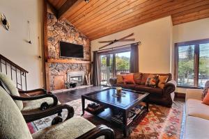 a living room with a couch and a table at RP128 Ski-IN OUT Silver Lake in Park City