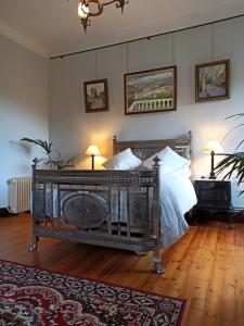 a bedroom with a bed with a fireplace in it at Santa Emilia in Mondoñedo