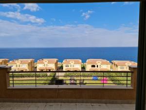 a view of the ocean from a balcony at Villa Telal Ain Sokhna in Ain Sokhna