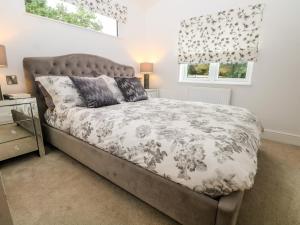 a bedroom with a bed and a window at Ruperts Retreat in Preston