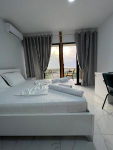 Postel nebo postele na pokoji v ubytování Restorant Hotel Xheni