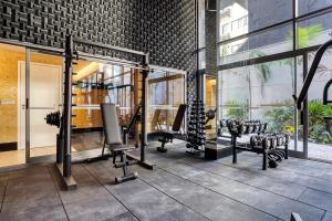 a gym with cardio equipment in a building at Tabas - Pivô Match Jardins - Cravinhos in Sao Paulo