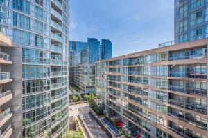 an aerial view of a city with tall buildings at Cozy 2BR Close to CN Tower & Harbourfront in Toronto