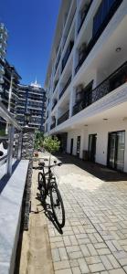 a bike parked in front of a building at Best life 6 in Alanya