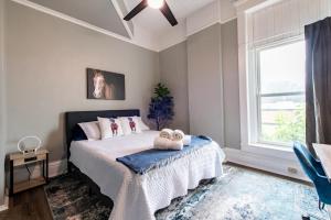 a bedroom with a bed with two stuffed animals on it at Suite near downtown Louisville, KY - Suite VII in Louisville