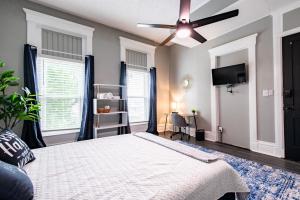 a bedroom with a bed and a ceiling fan at Suite near downtown Louisville, KY - Suite V in Louisville