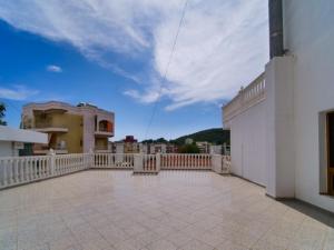 a view of a balcony of a house at Vironas Hotel in Himare