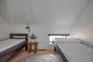 Postel nebo postele na pokoji v ubytování Brudtallen