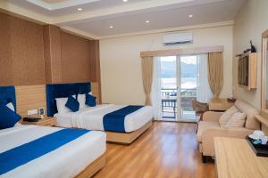 Majestic Lake Front Hotel & Suites 객실 침대