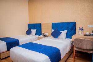 Majestic Lake Front Hotel & Suites 객실 침대