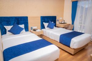 Majestic Lake Front Hotel & Suites 객실 침대