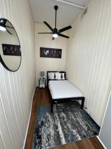 a bedroom with a bed and a ceiling fan at Suite near downtown Louisville, KY - Suite VIII in Louisville