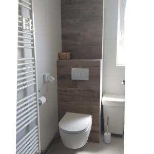 a small bathroom with a toilet and a sink at Apartman Nada in Ozalj