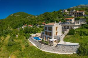 an aerial view of a house on a hill at Luxury Villa Flower in Budva