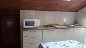 Kuchyň nebo kuchyňský kout v ubytování Apartment A&M