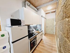 Kuchyň nebo kuchyňský kout v ubytování Edificio Amalia Rosina 1ºA + 7 fotografií