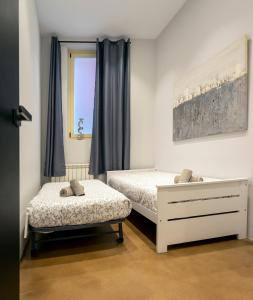 Łóżko lub łóżka w pokoju w obiekcie Loft Center Burgos by Unique Rooms