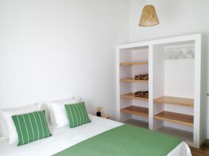 Ένα ή περισσότερα κρεβάτια σε δωμάτιο στο Terreiro Ocean House - Unique Seaside Escape