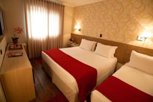 Cama ou camas em um quarto em LS Villas Hotel & Spa
