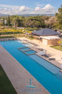 Výhled na bazén z ubytování Fortunity Club- Playa Dorada, Pto Plata nebo okolí