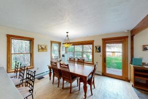 a dining room with a table and chairs at Bozeman Bungalow at Beall in Bozeman