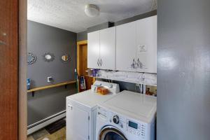 a laundry room with a washer and dryer at Bozeman Bungalow at Beall in Bozeman