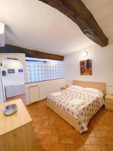 En eller flere senge i et værelse på Casedirio Apartment - Riomaggiore