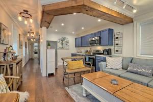 a living room with a couch and a table at King Bed Bungalow Just Feet from Historic Main Street in Blue Ridge