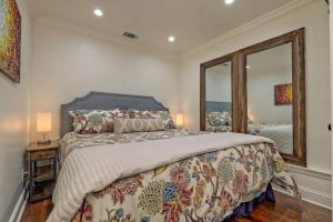 a bedroom with a bed and a large mirror at King Bed Bungalow Just Feet from Historic Main Street in Blue Ridge