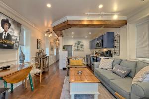 a living room with a couch and a table at King Bed Bungalow Just Feet from Historic Main Street in Blue Ridge