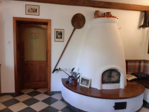 a living room with a circular fireplace in a house at Hungária Vendégház in Eger