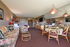 a living room with a couch and a table at Maui Kaanapali Villas #A317 in Lahaina