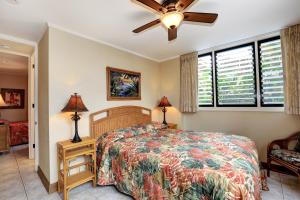 Uma cama ou camas num quarto em Pikake Unit A6
