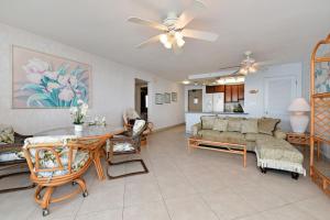 a living room with a couch and a table at Valley Isle 905 in Kahana