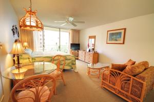 a living room with a couch and a table at Royal Kahana #319 in Kahana