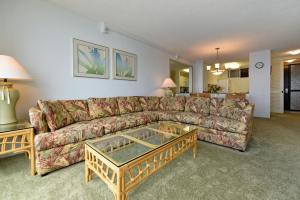 a living room with a couch and a coffee table at Mahana Resort #518 in Kahana