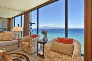 a living room with a view of the ocean at Mahana Resort #1104 in Kahana