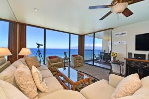 a living room with a couch and a tv at Mahana Resort #1104 in Kahana