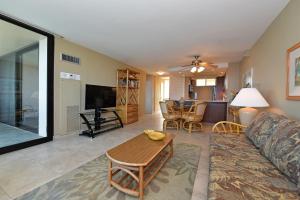 a living room with a couch and a table at Mahana Resort #906 in Kahana