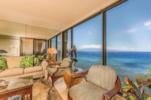 a living room with a view of the ocean at Mahana Resort #1017 in Kahana