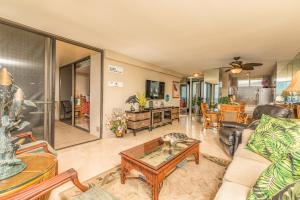 a living room with a couch and a table at Mahana Resort #1017 in Kahana