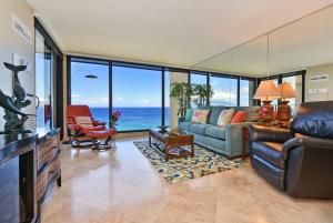 a living room with a view of the ocean at Mahana Resort #1205 in Kahana