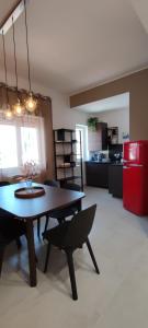 a living room with a table and a kitchen at Manzoni 159 in Naples +34 photos