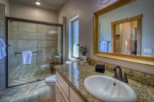 a bathroom with a sink and a shower and a toilet at 374 Hills Circle in Nutria +36 photos