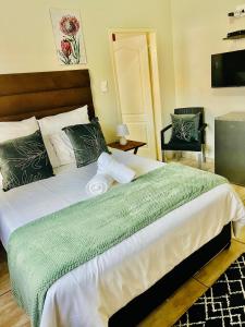 Ένα ή περισσότερα κρεβάτια σε δωμάτιο στο Sun Kissed guesthouse +20 φωτογραφίες
