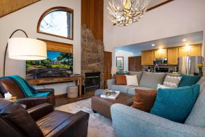 a living room with a couch and chairs and a fireplace at 175 Wildwood Dr Unit 3 in Pagosa Springs